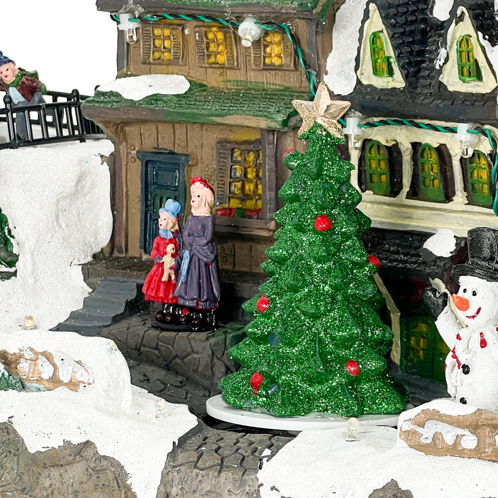 Casa navidad musical c/luz 37,5x18x20,5cm lineas tren